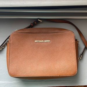 Tan Michael Kors crossbody with details